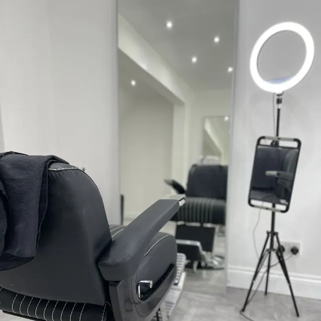 Inside 233.Barbers: the chair, mirror and ring light